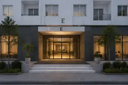 Entrée du hall vitrée avec marches et jardinières